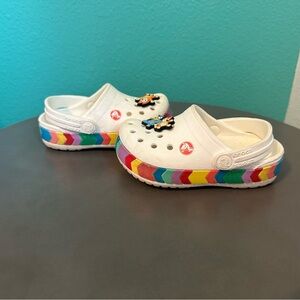 Toddler white Crocs with multi color band, Bluey charms. Size 7.